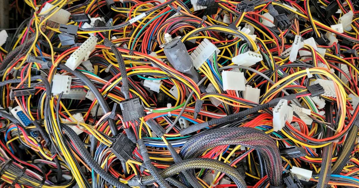 A dense mass of tangled coloured wiring