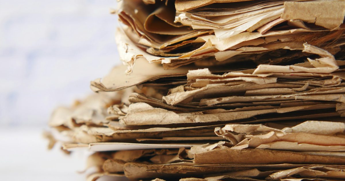 A thick stack of paper documents on a table